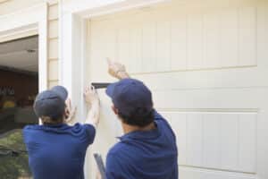 two men doing a pest inspection on a home